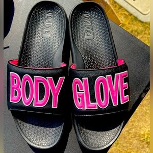 Pink and black Body Glove slide on sandals